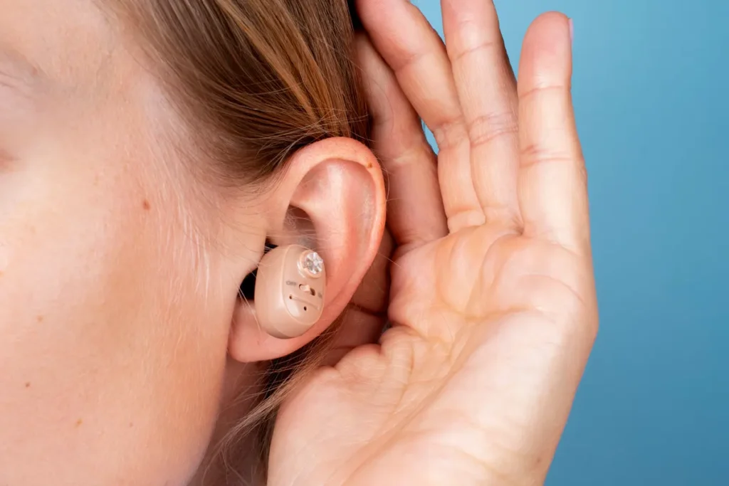 woman wearing hearing aids side view راهنمای جامع تنظیم سمعک در منزل مراحل تنظیم سمعک در منزل